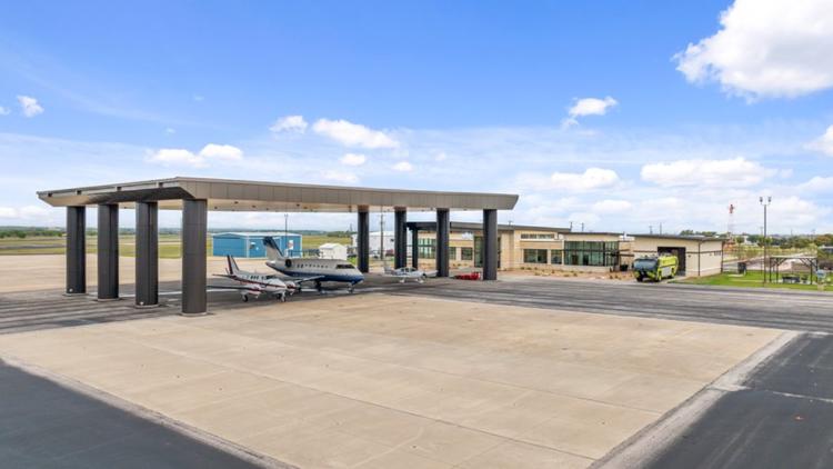 Emergency vehicles gathered at an airport runway during a simulated disaster drill